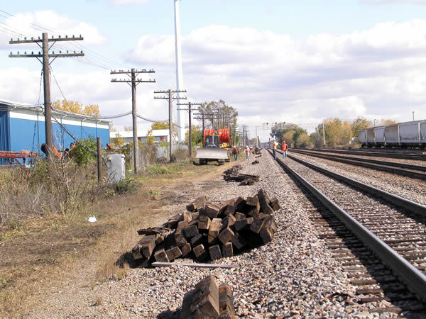 Placing duct with a cable plow along the railroad tracks for a placement & splicing project